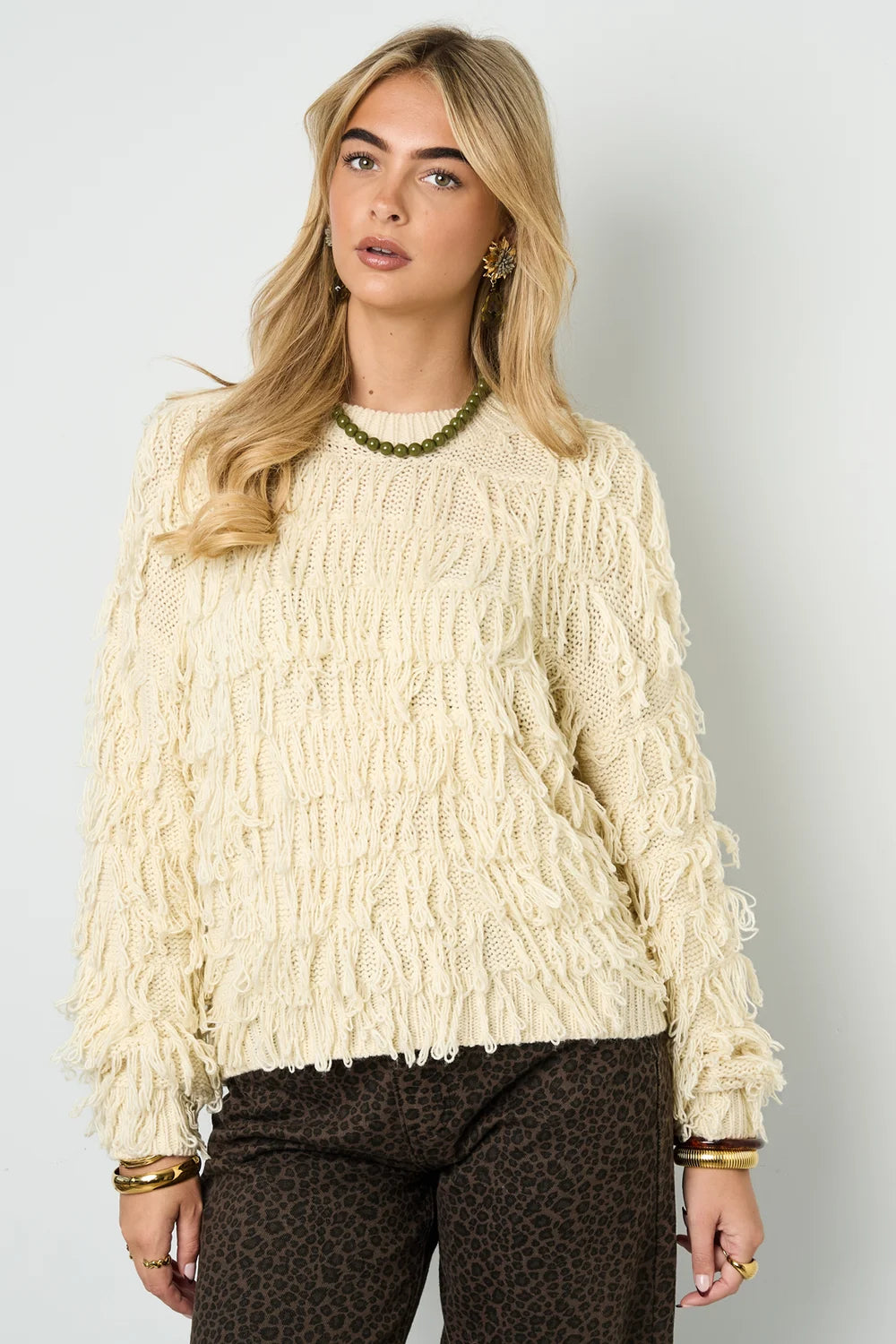 Knitted sweater with fringes